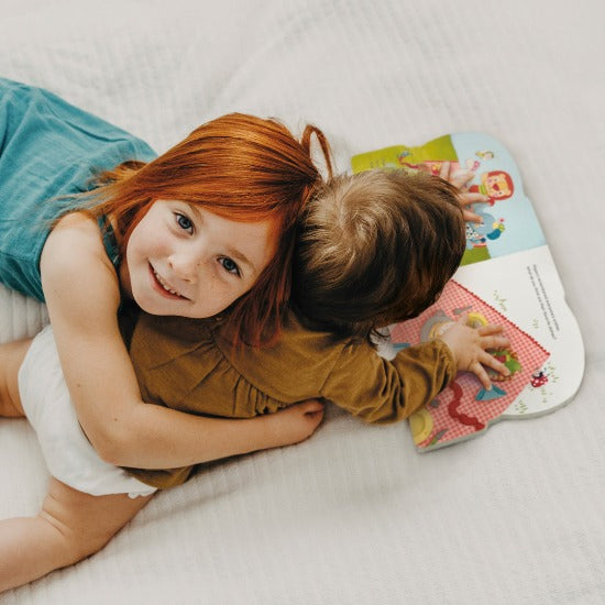 Baby Bababoo Book lifestyle image with children and open book