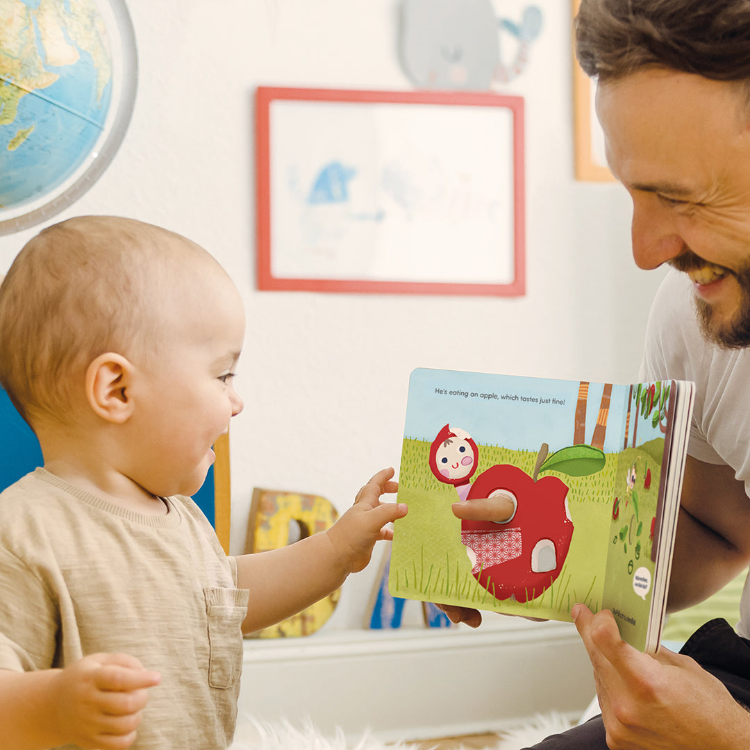 Little worm plays hide and seek finger book photo