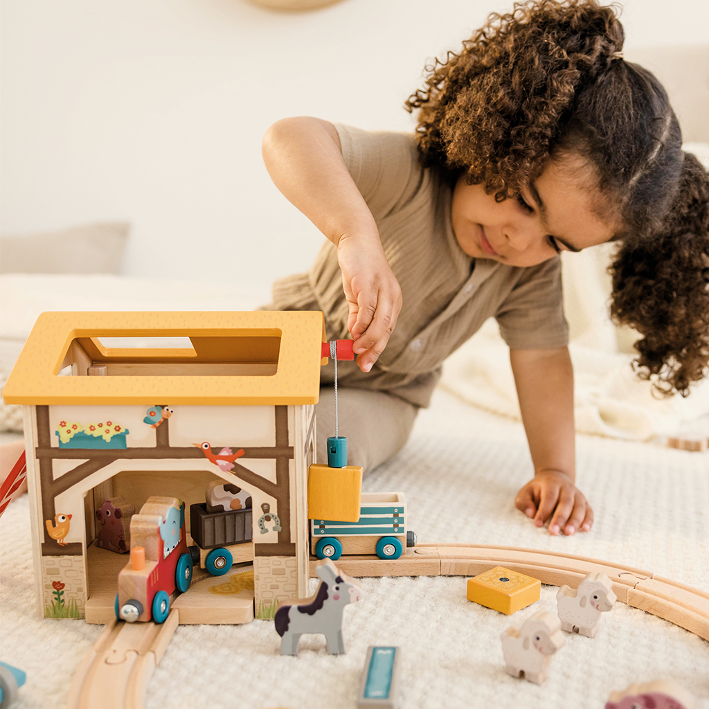 Farm Play World lifestyle image with child using toy crane